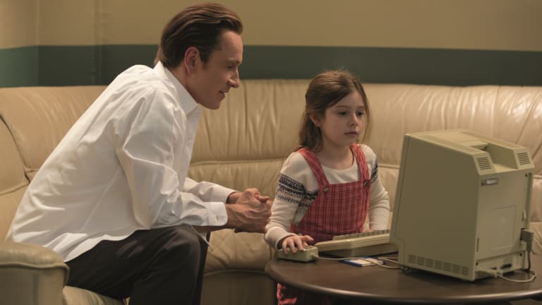 A scene from the film Steve Jobs showing Michael Fassbender as Steve Jobs and his daughter Kate as Lisa. 