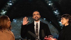 New York Attorney General Letitia James, left, administers the oath of office to mayor-elect Zohran Mamdani, center, as his wife Rama Duwaji looks on.