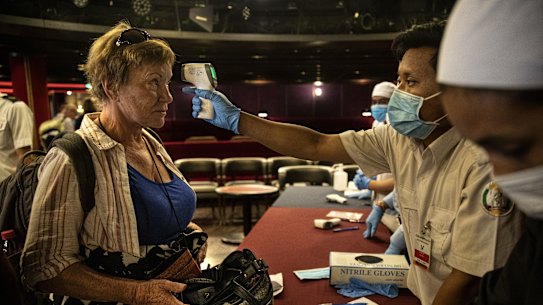Passengers preparing to disembark the Westerdam gather for a final health screening last week. 