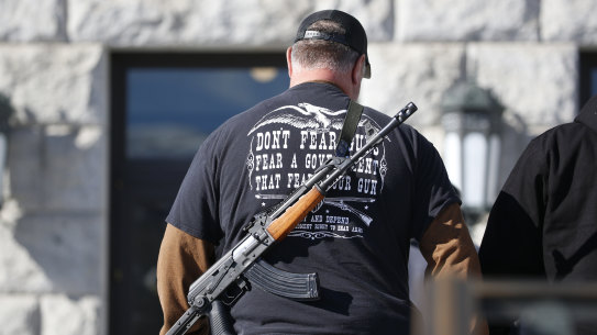 A man carries his weapon during a second amendment gun rally at Utah State Capitol in Salt Lake City last year.