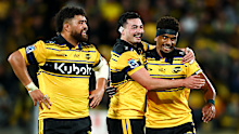 Siale Lauaki, Brayden Iose and Jone Rova of the Hurricanes celebrate the win.