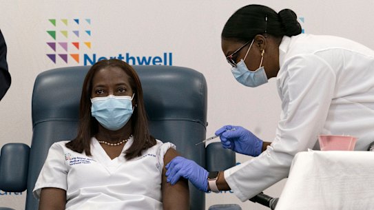 Sandra Lindsay, left, a nurse at Long Island Jewish Medical Centre, received the first vaccination in the US.