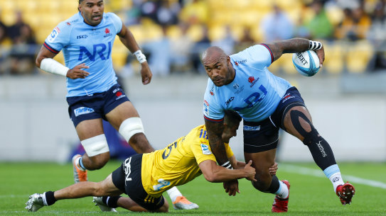WELLINGTON, NEW ZEALAND - MARCH 17: Nemani Nadolo of the Waratahs is tackled by Josh Moorby of the Hurricanes during the round four Super Rugby Pacific match between Hurricanes and NSW Waratahs at Sky Stadium, on March 17, 2023, in Wellington, New Zealand. (Photo by Hagen Hopkins/Getty Images)