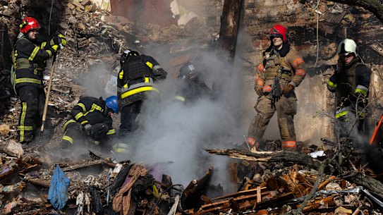 Firefighters at a four-storey residential building after a “kamikaze drone” attack in Kyiv on Monday.
