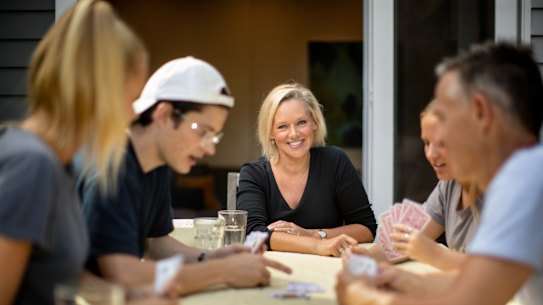 Psychologist Sabina Read and her family, plus a friend, playing cards during the shutdown.