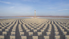 A molten salt tower solar thermal power station in Jiuquan, China. Molten salt is used as thermal storage to continue producing electricity even when the sun is not shining.