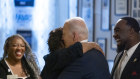 President Joe Biden, gets a hug from a supporter at Mary Mac’s Tea Room in Atlanta.