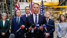 Defence Minister Richard Marles (centre) with Foreign Minister Penny Wong, UK Foreign Secretary David  Cameron, South Australian Premier Peter Malinauskas, UK Secretary of State for Defence Grant Shapps and US ambassador Caroline Kennedy in Adelaide on Friday.