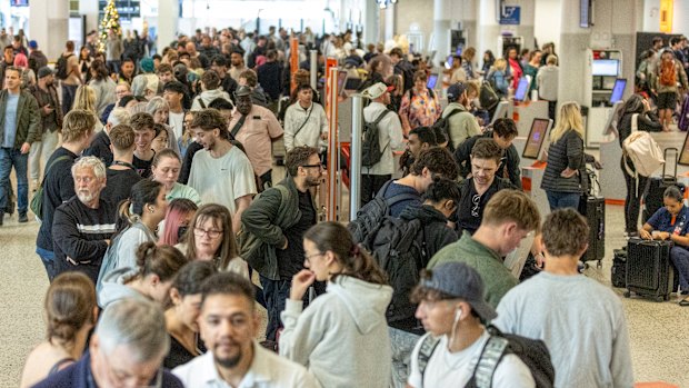 Passengers queuing at Melbourne Airport on Saturday after the Airbus warning.