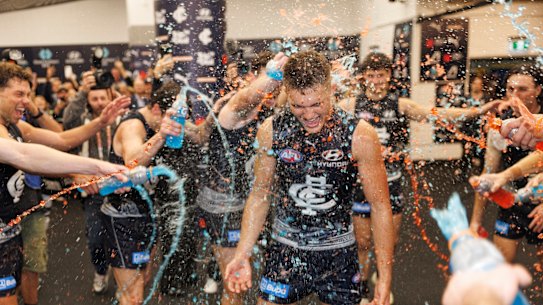 Jack Ison of the Blues receives a Gatorade shower after winning on debut.