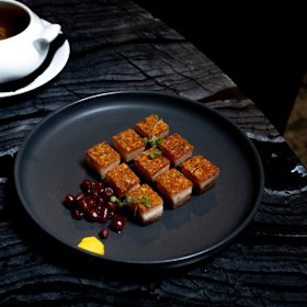 Roasted pork belly, crispy crackling and native berry.