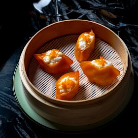 Prawn dumpling, egg white cloud and flying fish roe.