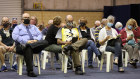 Perth residents wait to receive a vaccination at one of the state’s new hubs on Monday. 