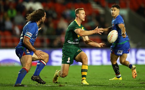 Daly Cherry-Evans passes for Australia against Italy.