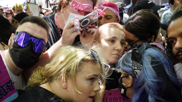 Britney Spears supporters listen to a feed from the courtroom outside a hearing in Los Angeles.