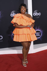 Lizzo arrives at the American Music Awards.