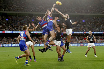 Tim English of the Bulldogs spoils the ball during the round two AFL match between the Western Bulldogs and the Carlton Blues.