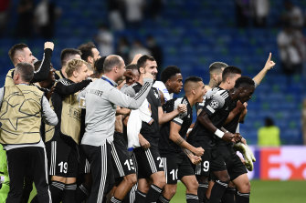 Sheriff players and staff celebrate their 2-1 win over Real Madrid at the Bernabeu.