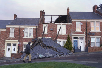 A house in Gateshead, north-east England lost its roof after the region was battered by strong winds from Storm Malik. 