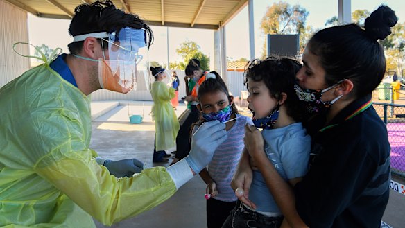 Latisha Carr-McEwan and her children at a Dubbo testing clinic on Monday.  