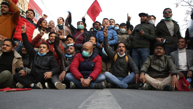 Nepalese students affiliated with Nepal Student Union chant slogans against Prime Minister Khadga Prasad Oli during a protest in Kathmandu on Sunday. 