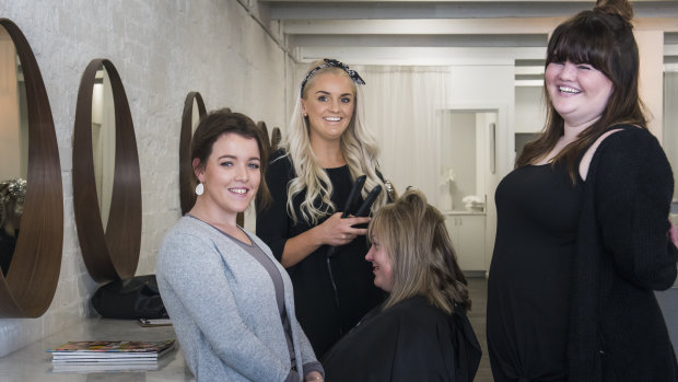 Kalinda McClellan-Weaver, left, was in a 'desperate situation' at Karinya House and now with the help of KOVU Hair co-owner, Samantha Jayne Harvey and Catherine Hickey has a full time apprenticeship at the salon.
