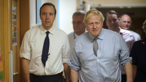 Health Secretary Matt Hancock and Prime Minister Boris Johnson during a tour of a hospital.