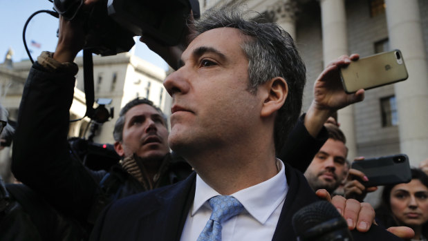 Michael Cohen walks out of federal court after pleading guilty to lying to Congress about work he did on an aborted project to build a Trump Tower in Russia. 