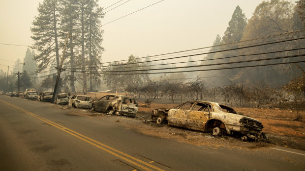 Abandoned vehicles line a road after a fire tore through the Californian town of Paradise last month.