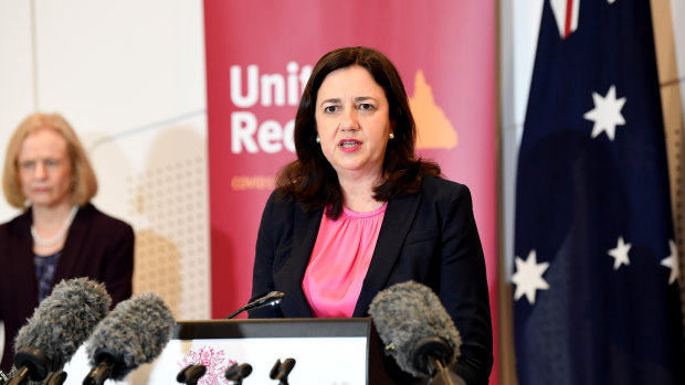 Queensland Premier Annastacia Palaszczuk speaks at a press conference as Dr Jeannette Young looks on. 