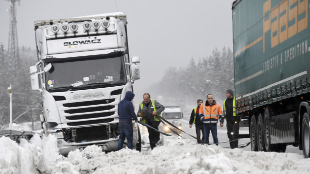 Truck drivers trapped by snow on the motorway near Holzkirchen, Germany.