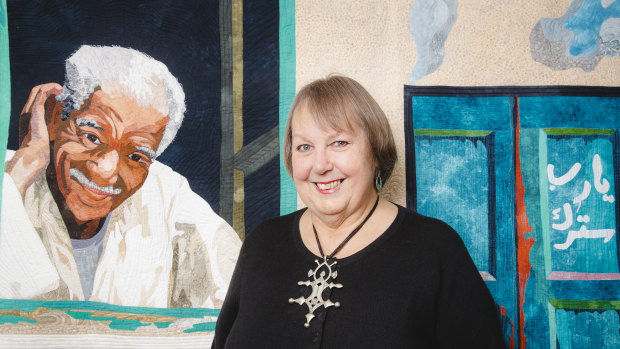Quilter Jennifer Bowker, who has been named an officer in the Order of Australia for her achievements in quilting. Mrs Bowker is pictured with her quilt depicting a friend.