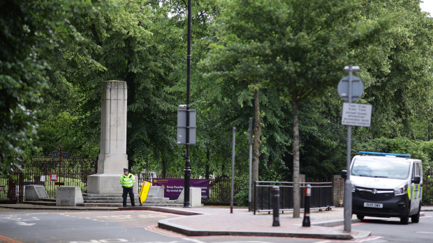 Police guard an entrance to Forbury Gardens, where a lone attacker targeted groups of people socialising.