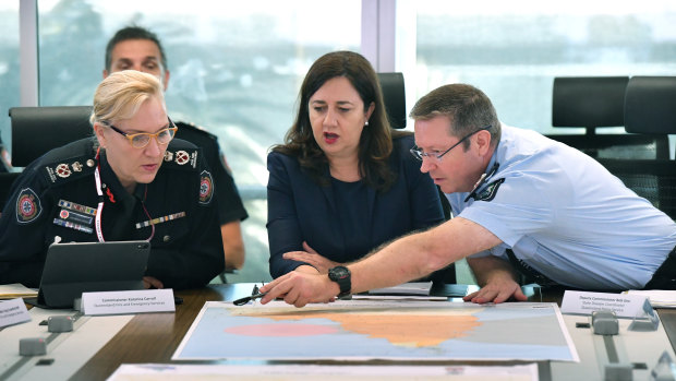 Changing roles: Queensland Fire and Emergency Services Commissioner Katarina Carroll (left), who will be the Police Commissioner from July, Queensland Premier Annastacia Palaszczuk and newly appointed Youth Justice director-general Bob Gee (right) 
at a meeting of the Queensland Disaster Management Committee on Tuesday, Tuesday, March 19, in response to Cyclone Trevor.