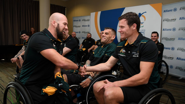 Proud moment: Australian wheelchair rugby team captain Ryley Batt (left) presents Andrew Edmondson with a Steelers jersey on Thursday.