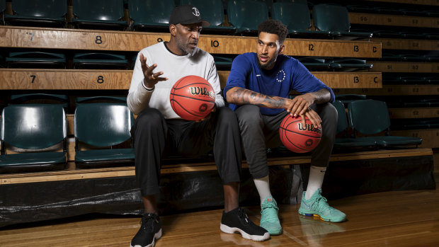New 76ers player Jonah Bolden with his NBL legend father Bruce Bolden.