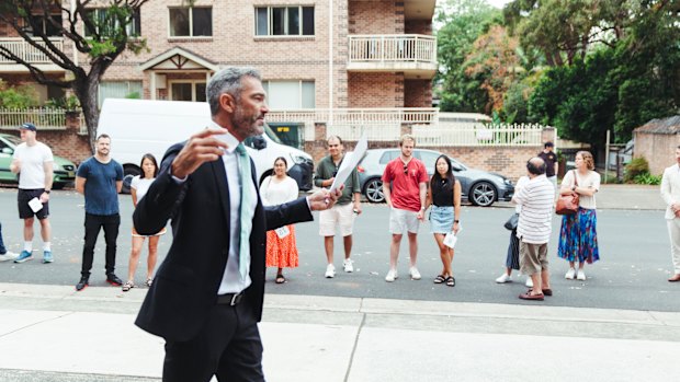 Auctioneer Brad Heffernan prepares to sell the Marrickville unit.