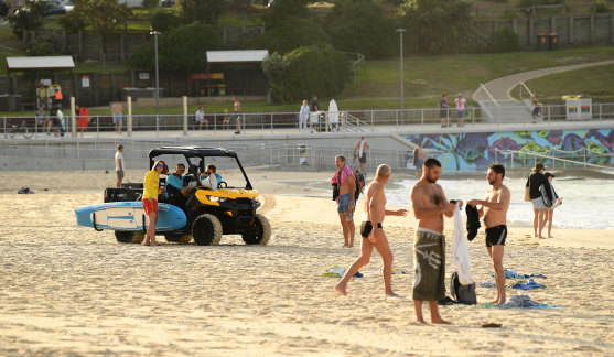 Lifeguards ask people to leave the beach on Sunday morning.