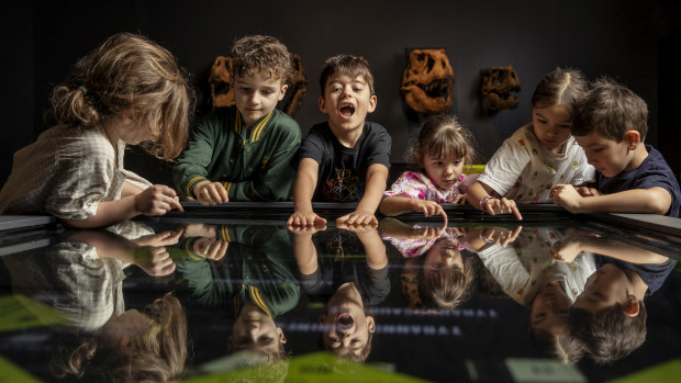 Kids flocked to an interactive game in the middle of the exhibition hall at the museum.