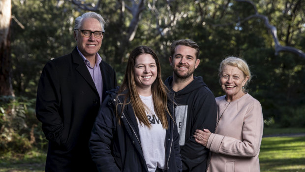 Steve Folkes' daughter Hayley Folkes-Shaw and son Dan Folkes with Professor Michael Buckland, left, and Bulldogs chairwoman Lynne Anderson, right.