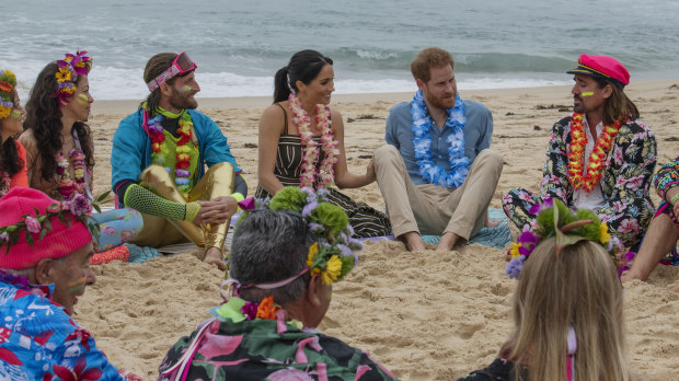 Prince Harry and Meghan Markle join One Wave's ‘anti bad vibes circle’ at Bondi Beach in October last year.