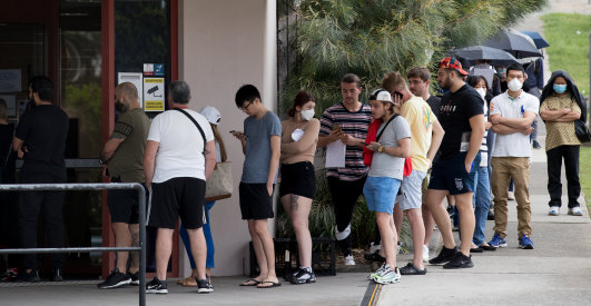 People queue outside Centrelink at Rockdale on Tuesday.