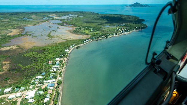 Flying into Saibai Island. Its $24 million sea wall was breached less than six months after its completion. During storm surges, the sea sluices under homes.