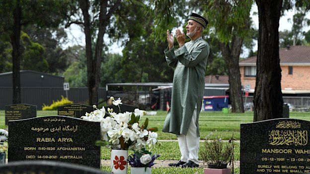 Kazi Ali OAM prays in the Muslim section of Kemps Creek Memorial Park.