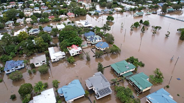 Houses in Lismore, northern NSW, surrounded by flood water in March.