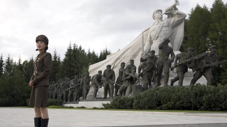 A North Korean guide gives a tour of Samjiyon Great Monument in Samjiyon.