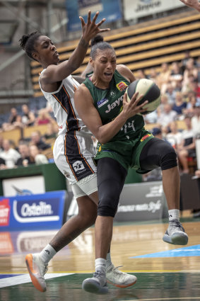Ranger danger: Dandenong's Betnijah Laney muscles her way to the basket against Townsville’s Laurin Mincy.