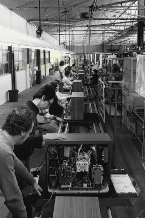 Technicians at National's manufacturing plant at Penrith, work on Pana-Colour TV sets on December 27, 1974.