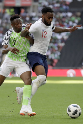 Nigeria's Ahmed Musa battles with England's Danny Rose