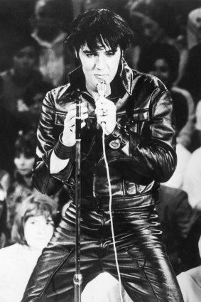 Greg loves the Elvis look – black leather, bomber jacket – and even 
has a pair of blue suede shoes.